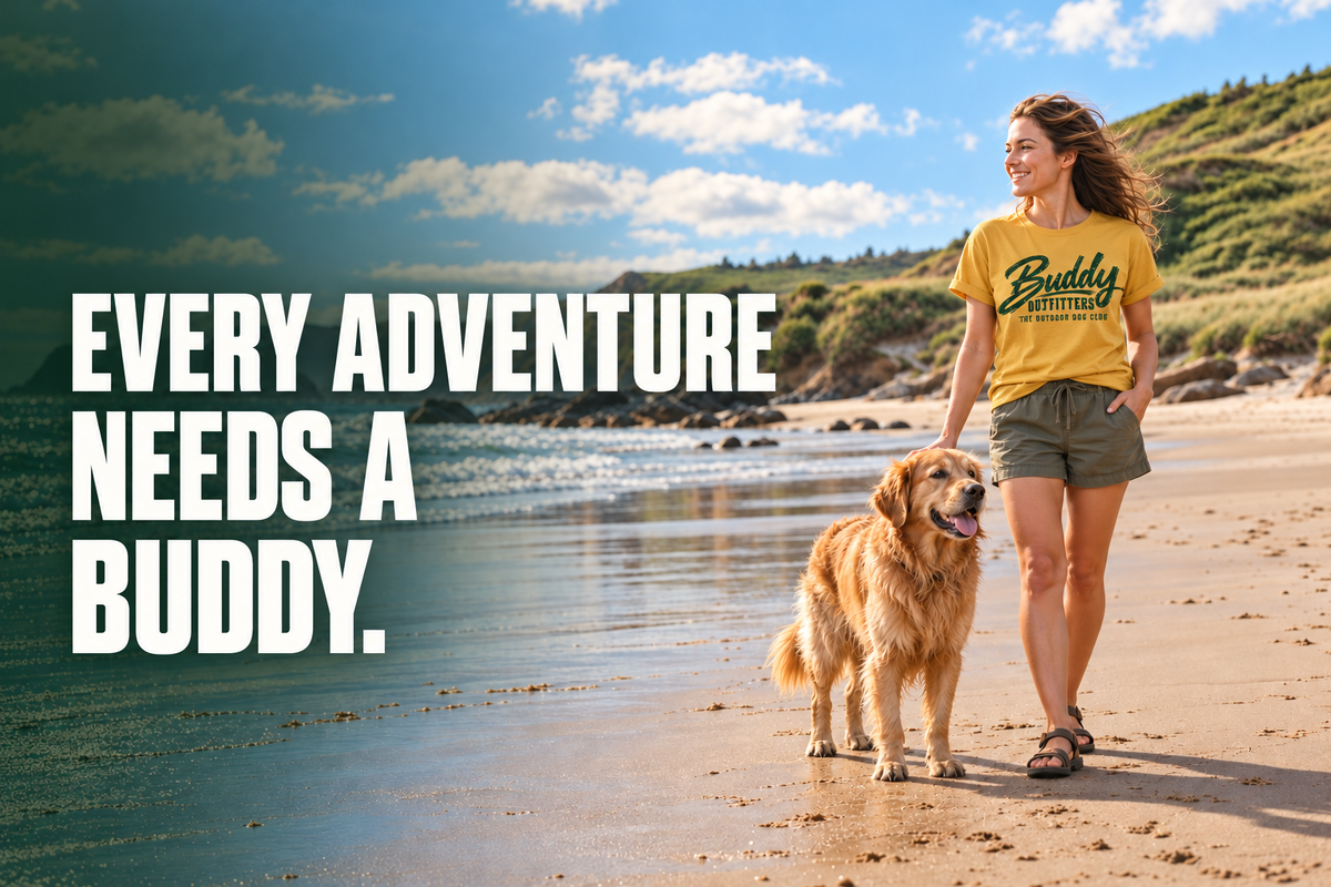 Woman in a Buddy Outfitters T-shirt walking her golden retriever on the beach – Every adventure needs a buddy